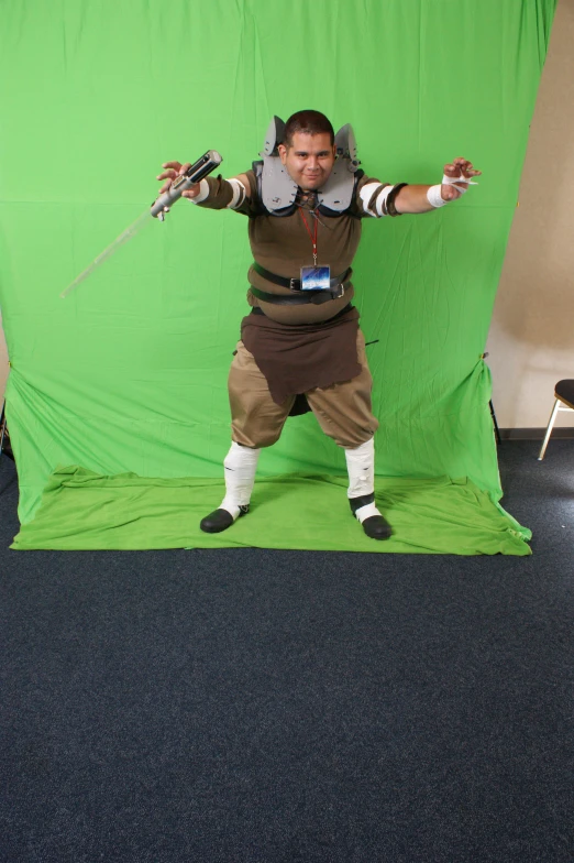 a man in costume with two swords holding soing