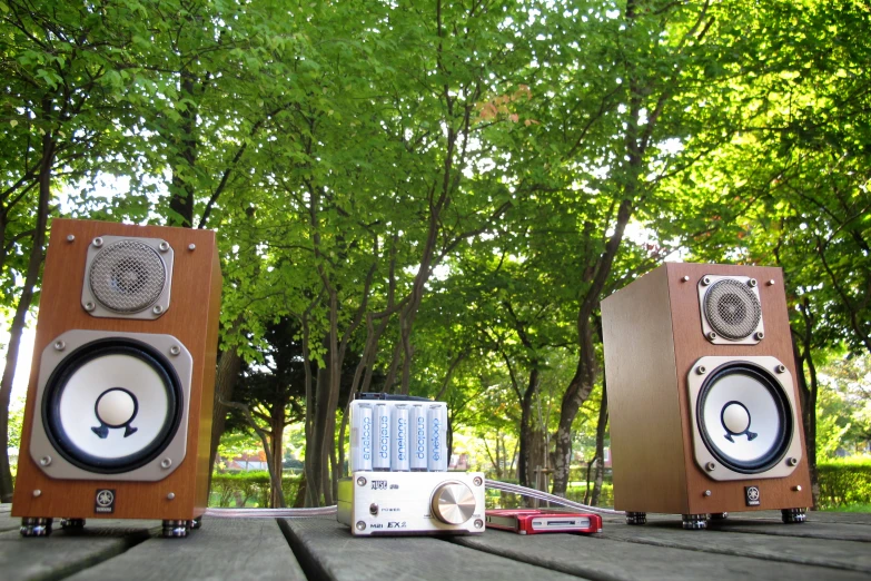 stereo equipment sit on the edge of a picnic table