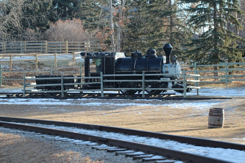 an old train that is sitting on the tracks