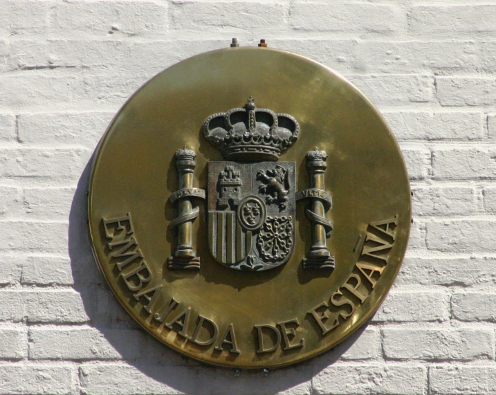 the emblem is located on a brick wall