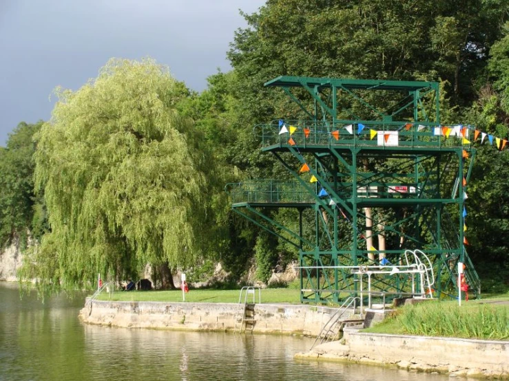 a large metal structure on stilts over water