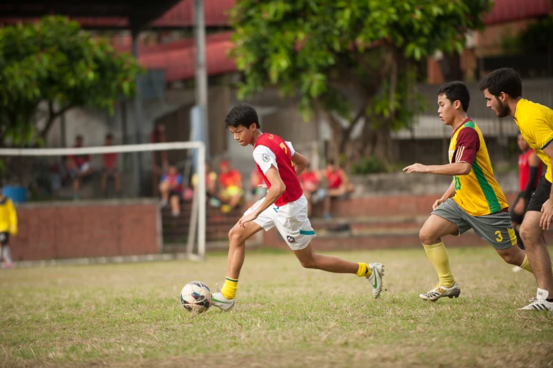 two men are playing soccer on the field