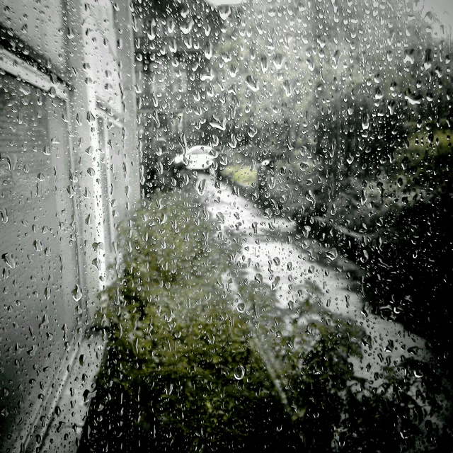an image of rain falling from the glass