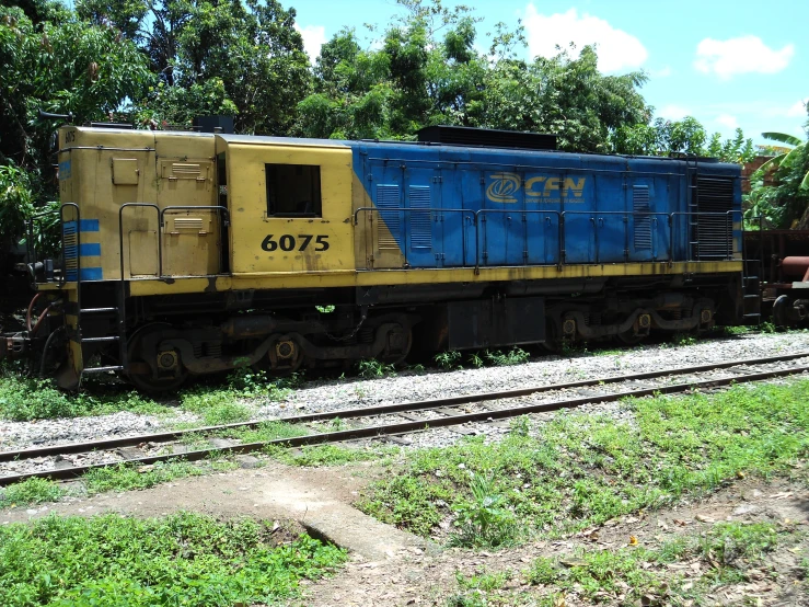 a train engine with many blue boxes on it