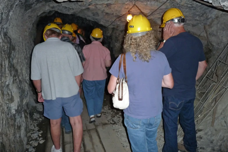 a group of people wearing helmets in a tunnel