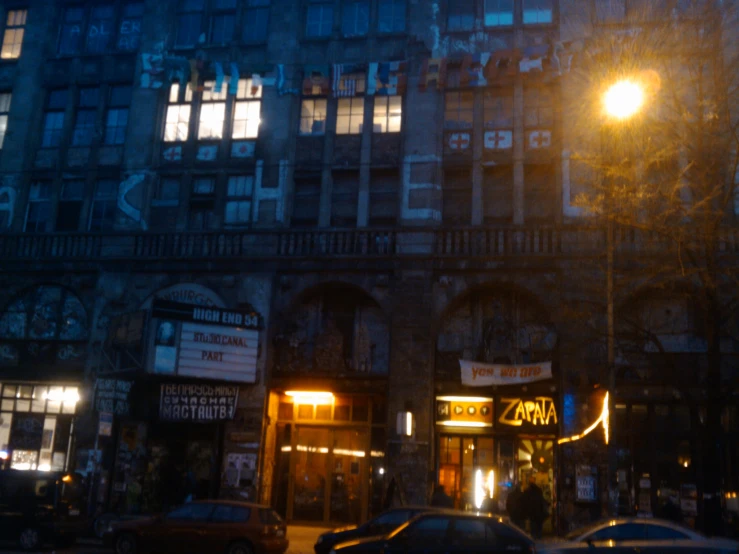 an old building is lit up at night