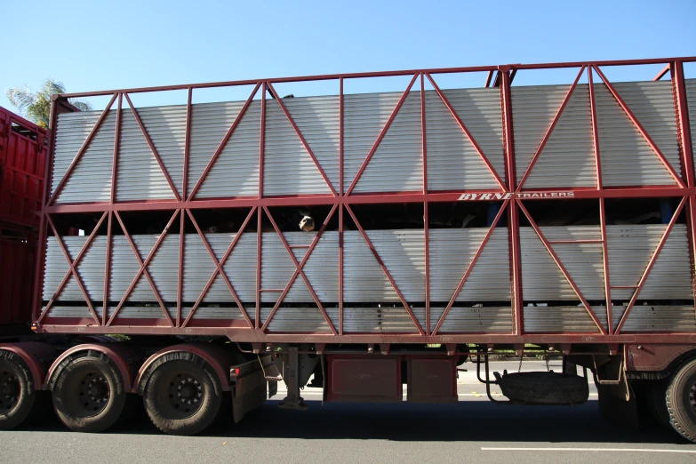 a semi - truck with some steel containers in the back