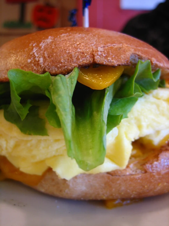 a sandwich with egg and lettuce in between it