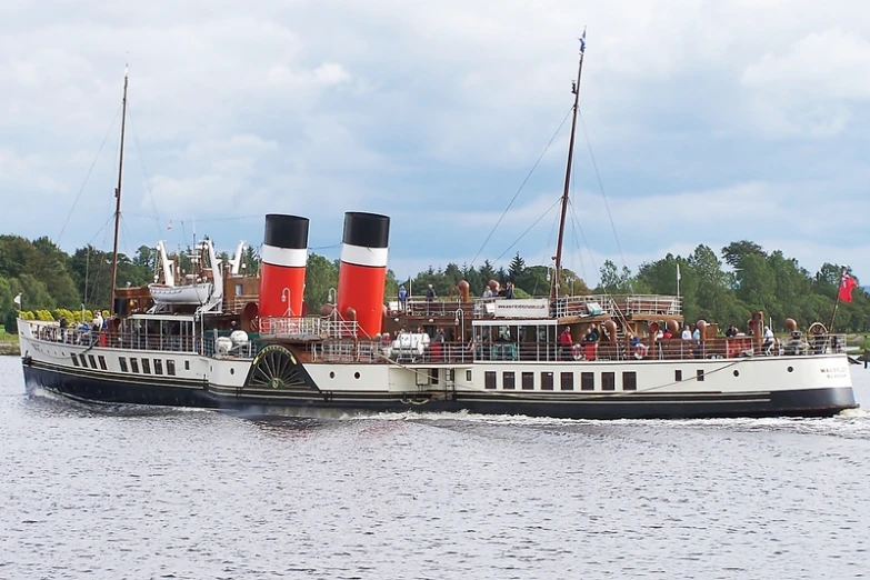 the large boat has several red and white stripes on it
