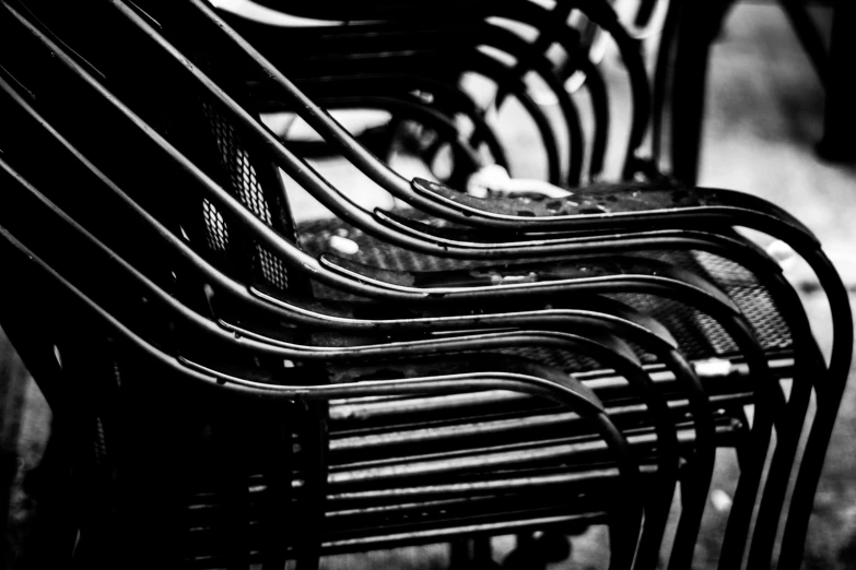 several empty benches lined up against each other