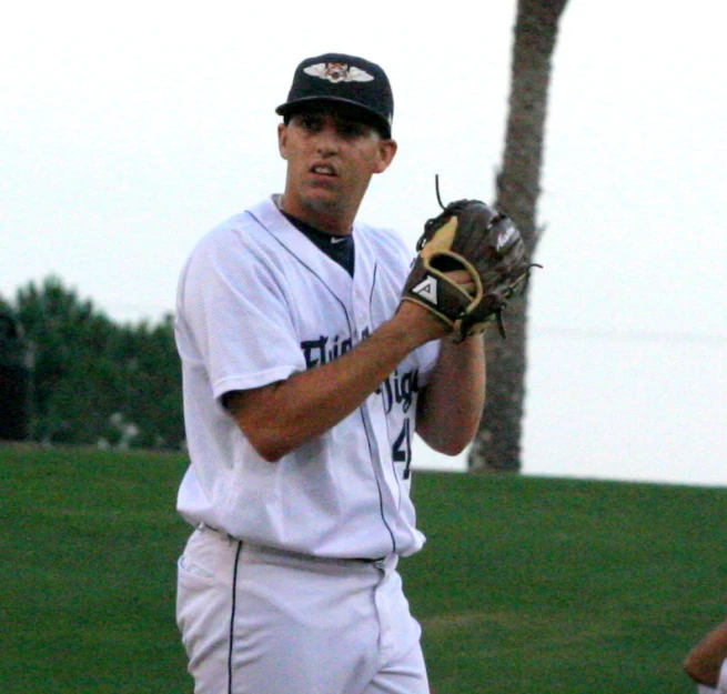 a man with a catcher's mitt on his arm