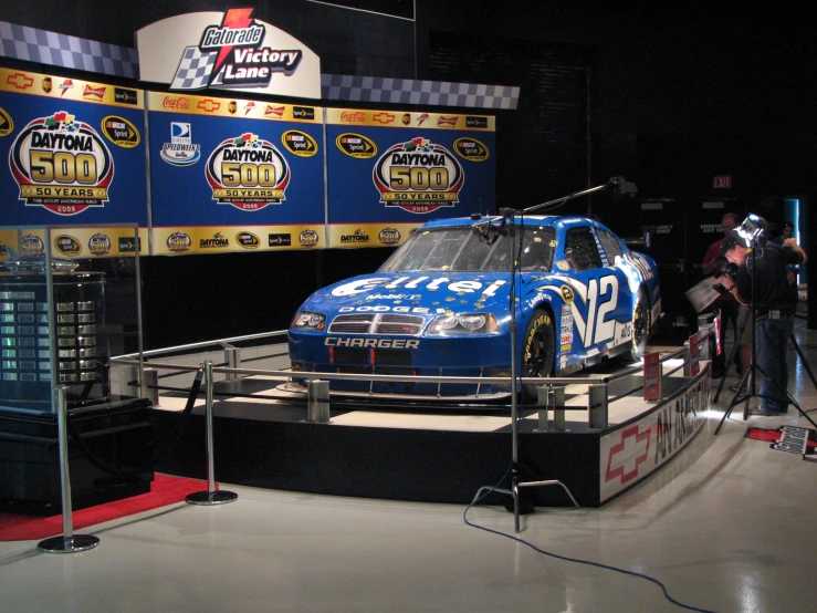 a nascar car is displayed at the auto museum