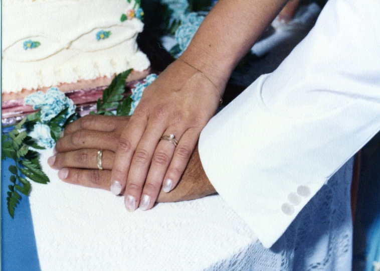 the bride and groom are getting ready to cut their wedding cake