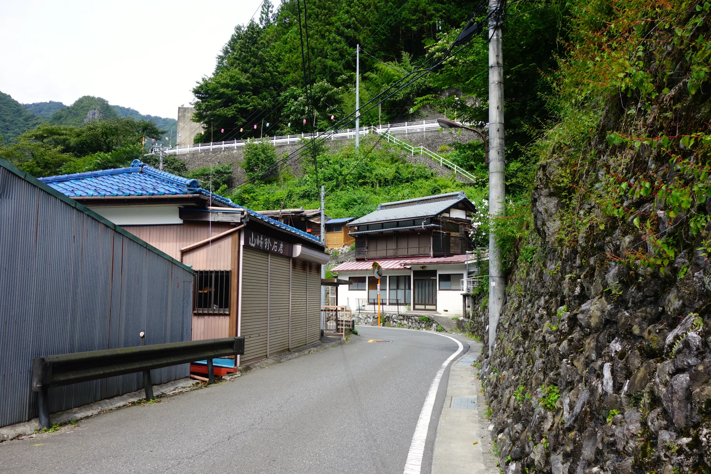 this street has several buildings and a fence near it