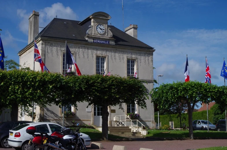 a building that has several flags around it