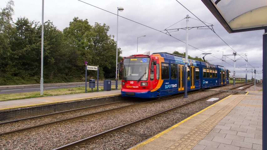 a passenger train pulls up to the platform