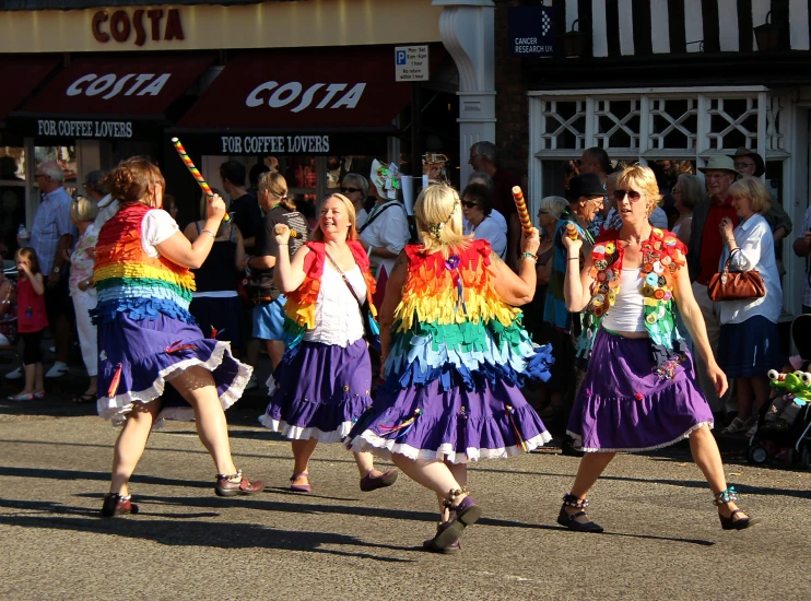 a group of people standing in the street