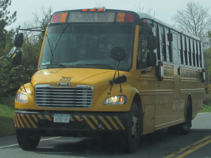 yellow school bus parked in a parking lot