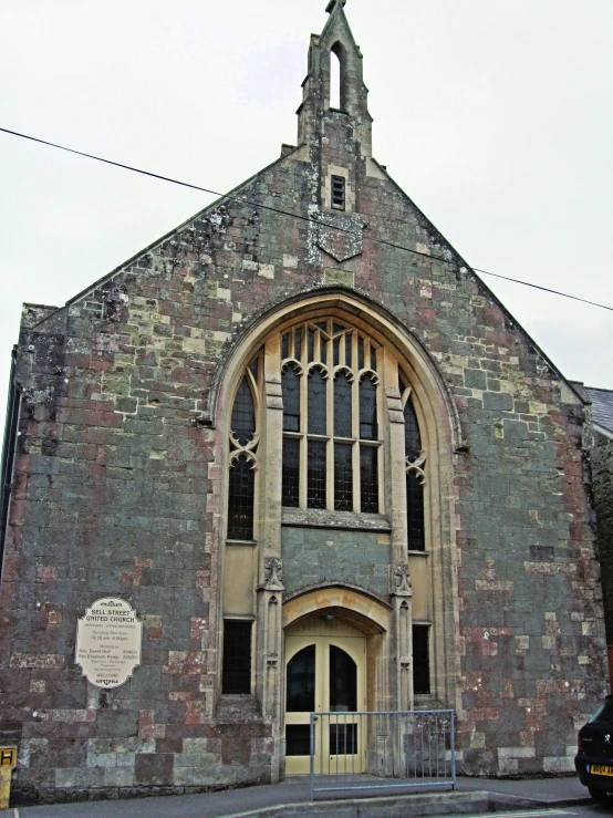 an old stone church with clock tower