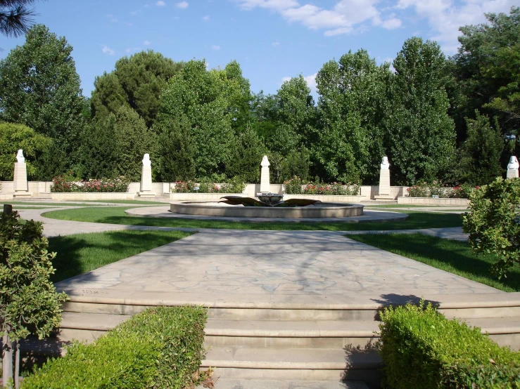 the stone steps lead to a stone fountain