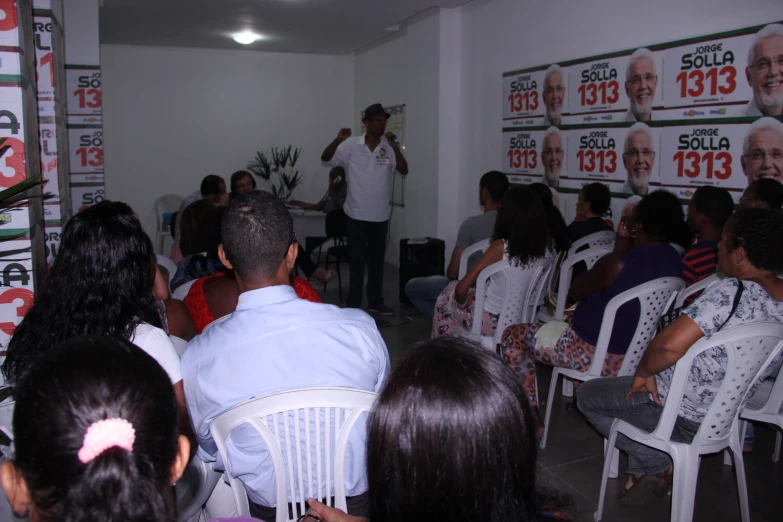 a man giving a speech to an audience