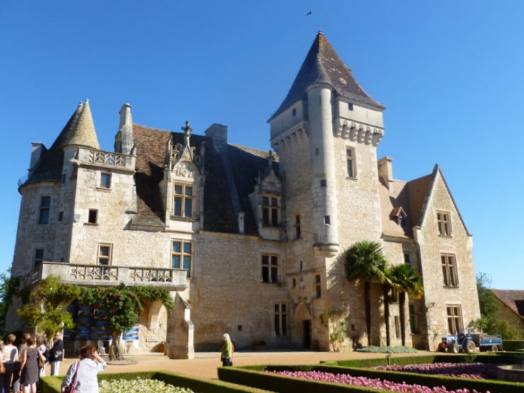 the castle with people milling around outside