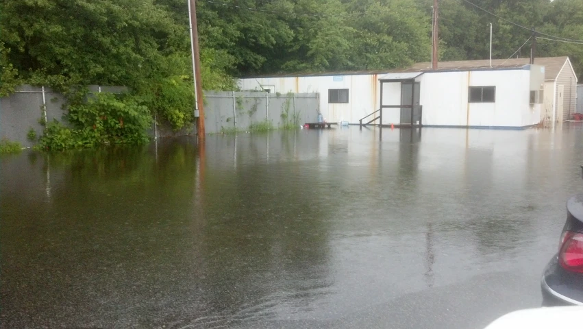 the view from inside of a house, in a flooded area