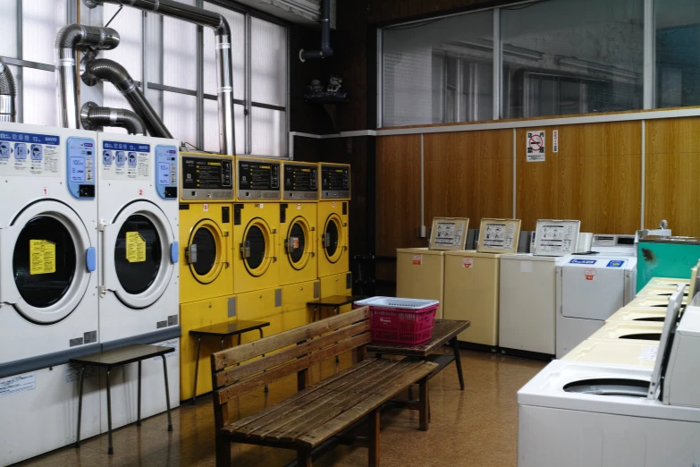 a dryer, washer and other appliances are in the front of a room