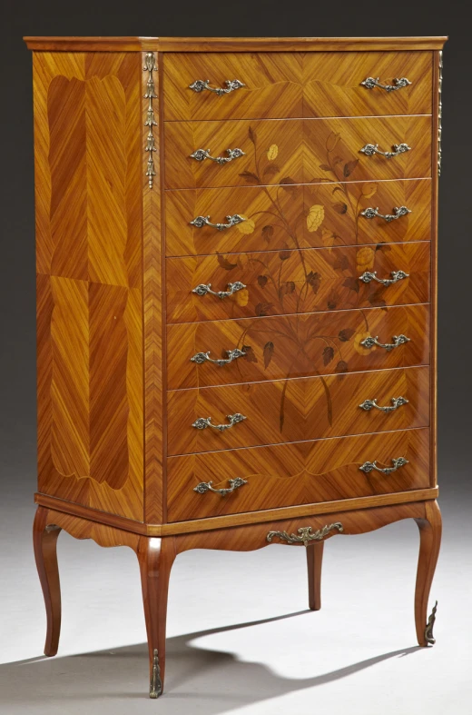 a dresser is shown with drawers and a fancy design