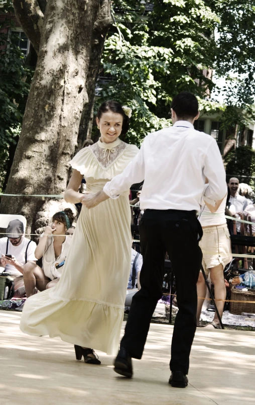 a man and woman dressed in historical clothing