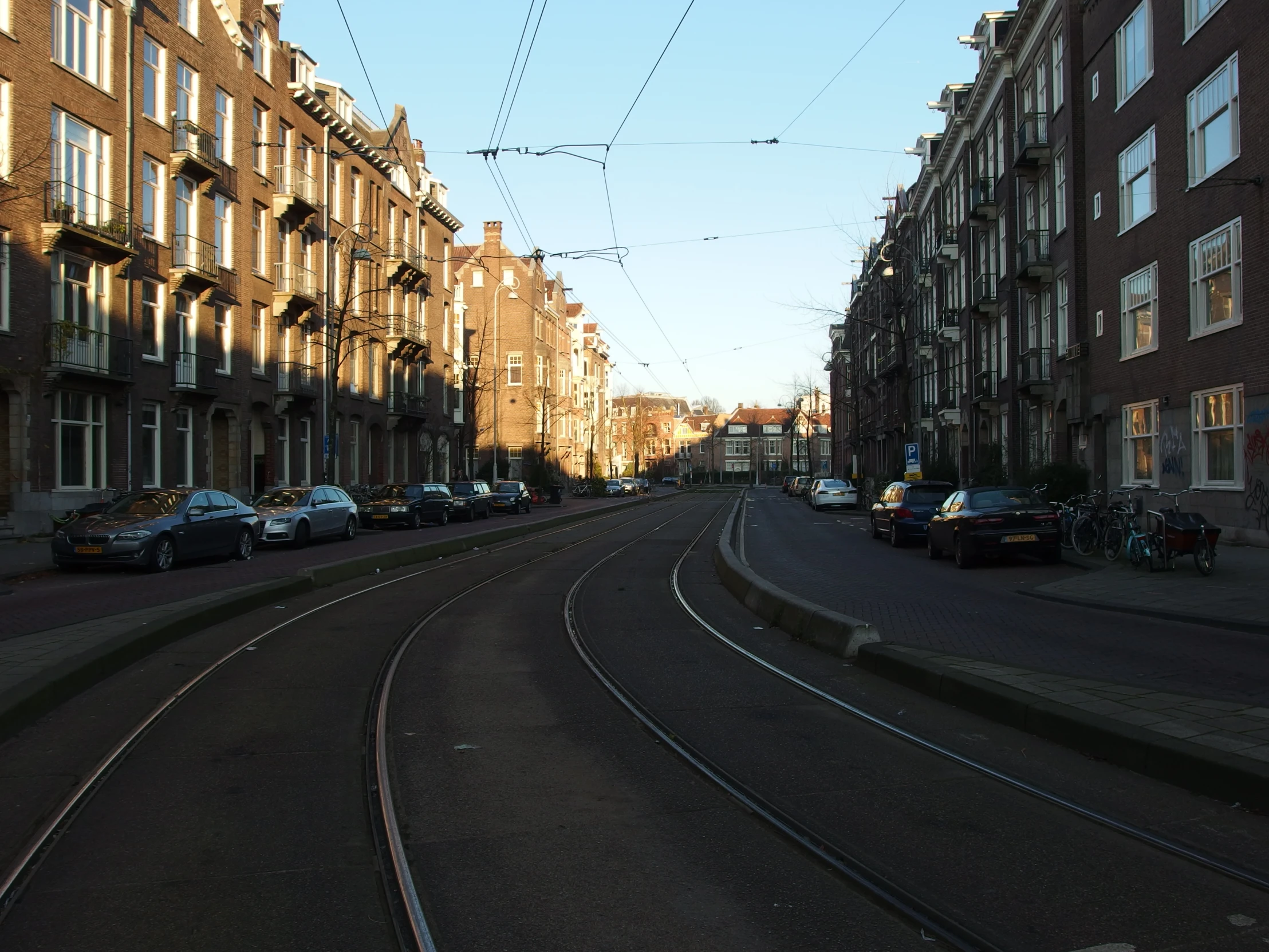 a view down a city street during sunset