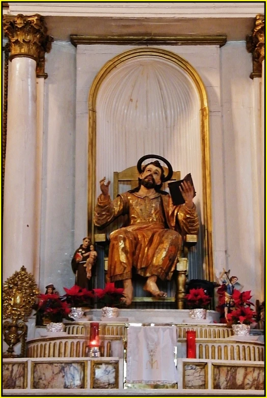 a statue of saint john inside a cathedral