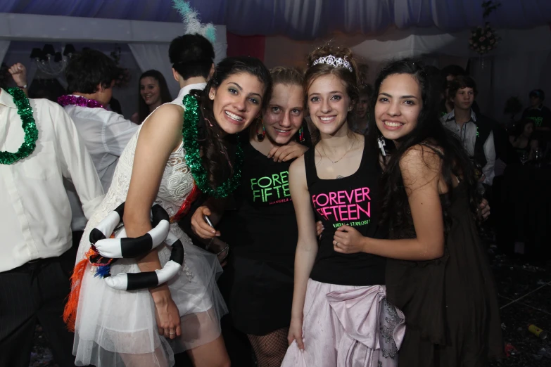 several young women smiling with costumes and tutus on