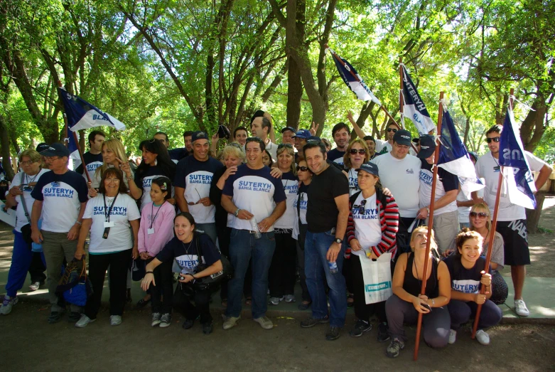 group po showing various people holding flags at outdoor event