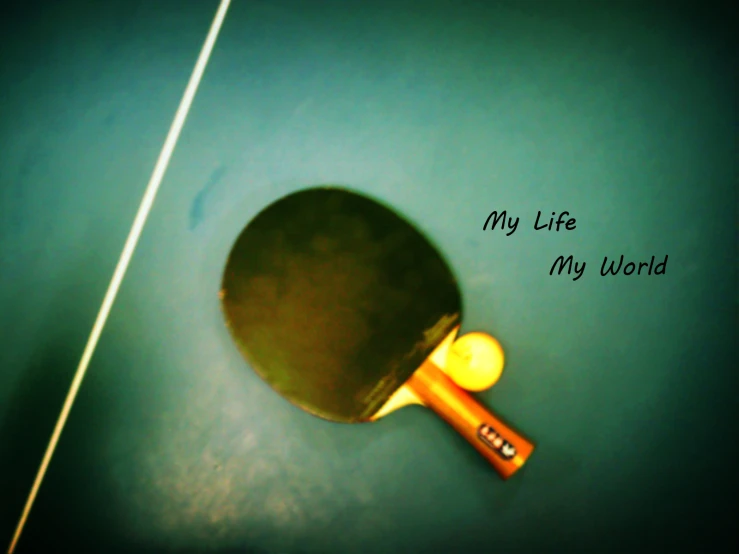 a ping pong paddle resting on the floor
