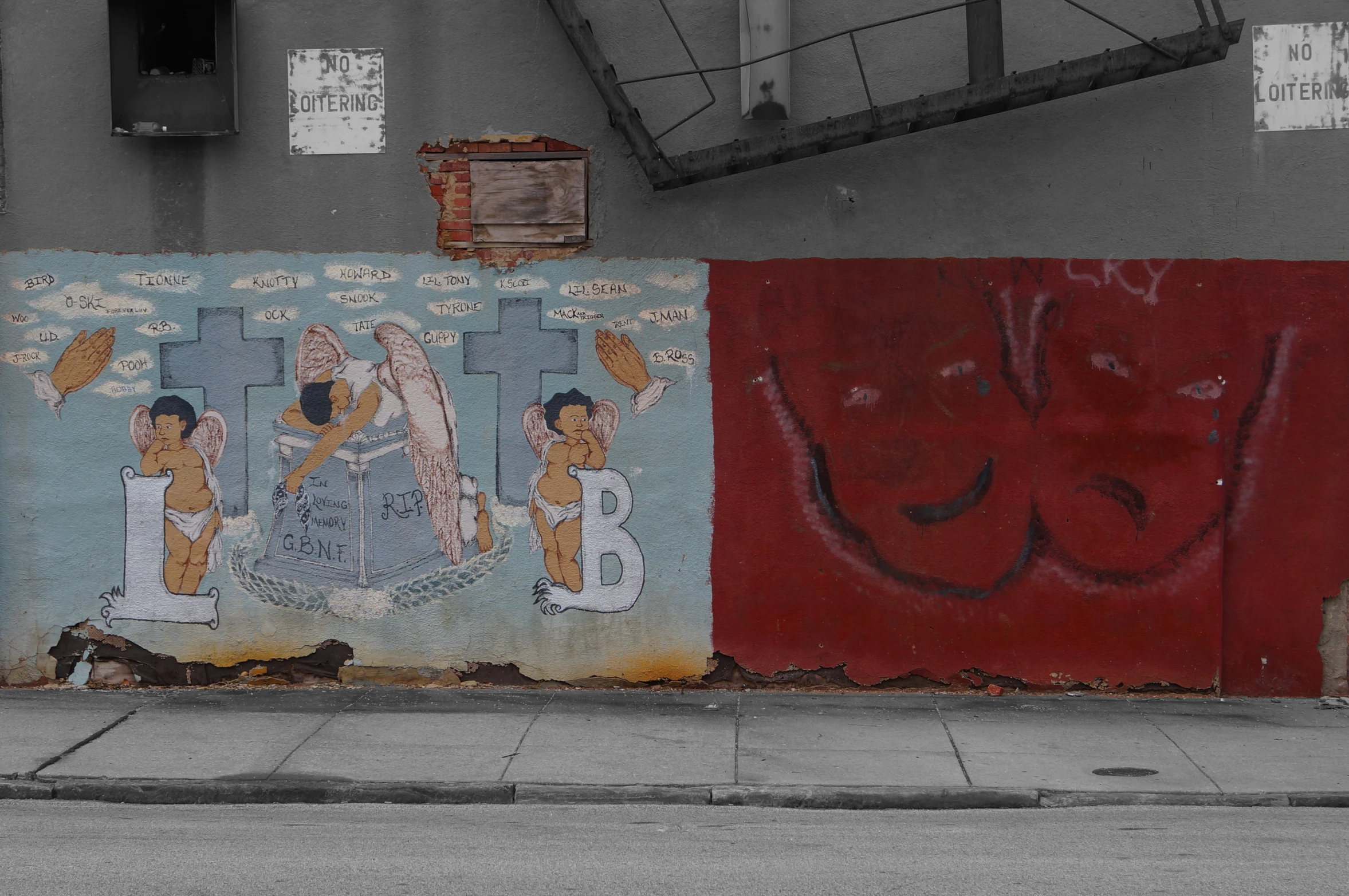 a fire hydrant is in front of a colorful wall