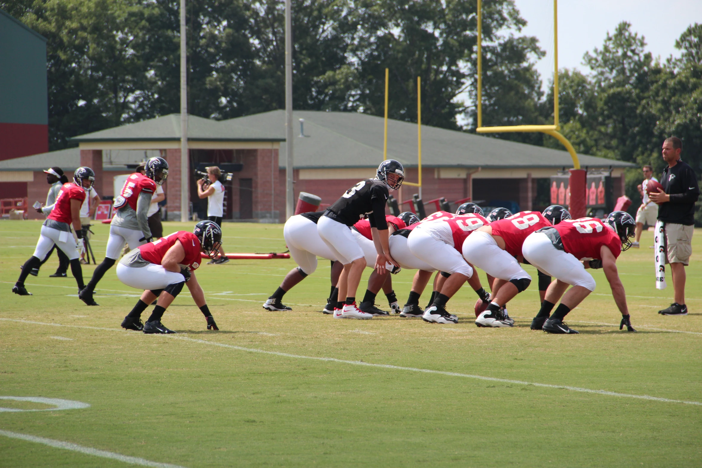 many football players on the field waiting to play