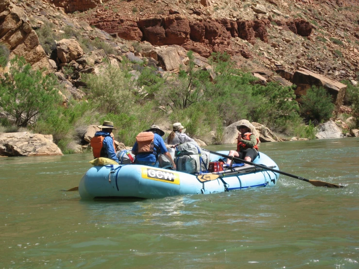 a raft with people riding it across the water