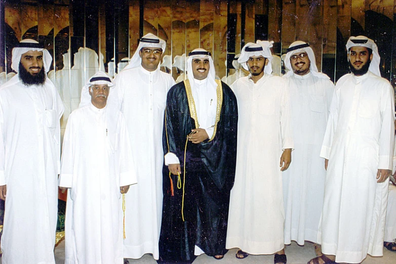 a group of men standing in a row