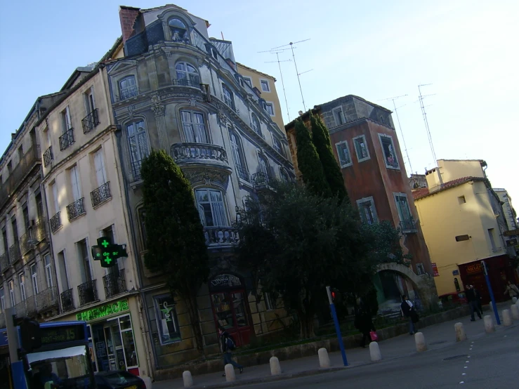 a building with many windows near many tall buildings