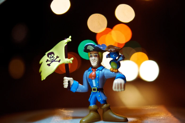 a plastic figurine with an umbrella in it