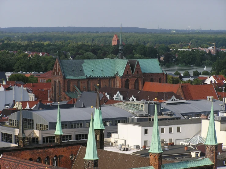 old buildings with roofs and spires in a city
