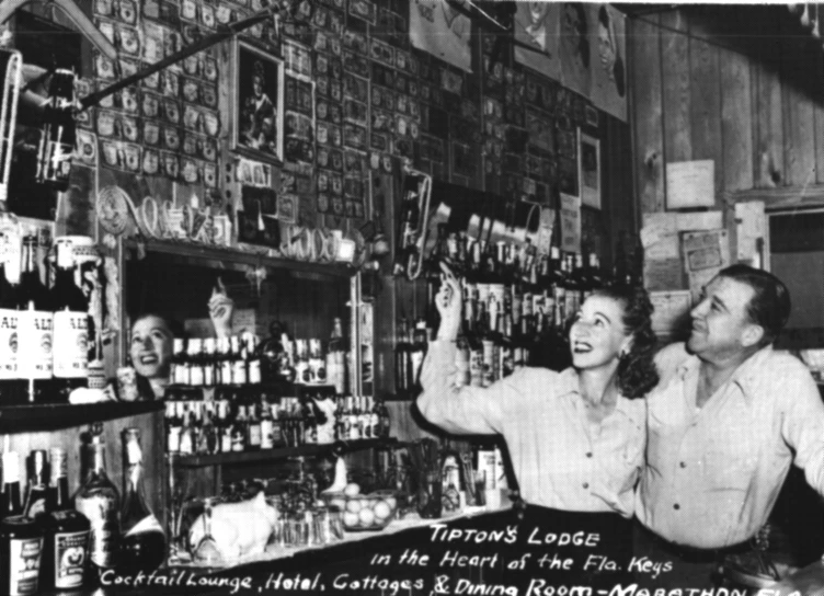 this old black and white po shows people in the liquor store