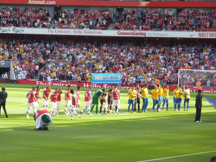 the soccer players are getting ready for the match