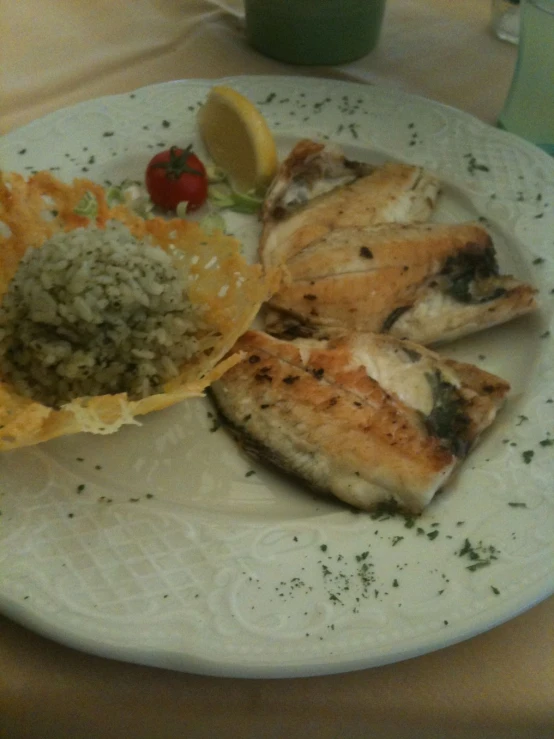 food sitting on a white plate with tomatoes, broccoli and meat