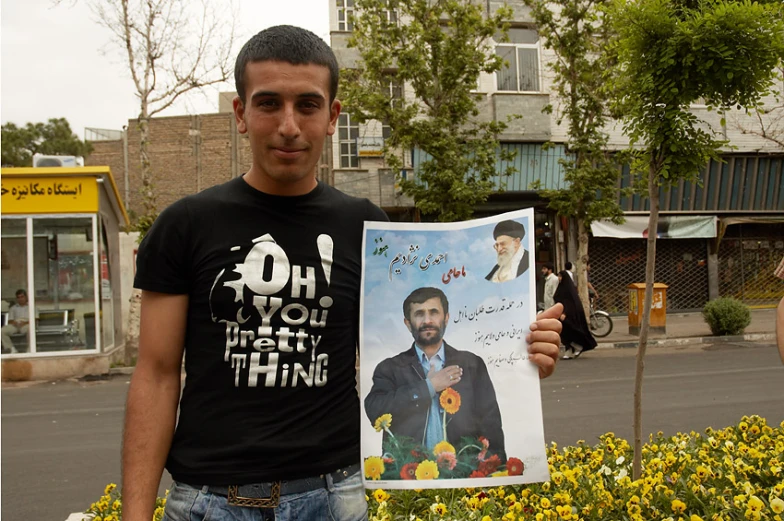 a man holding up a po of himself