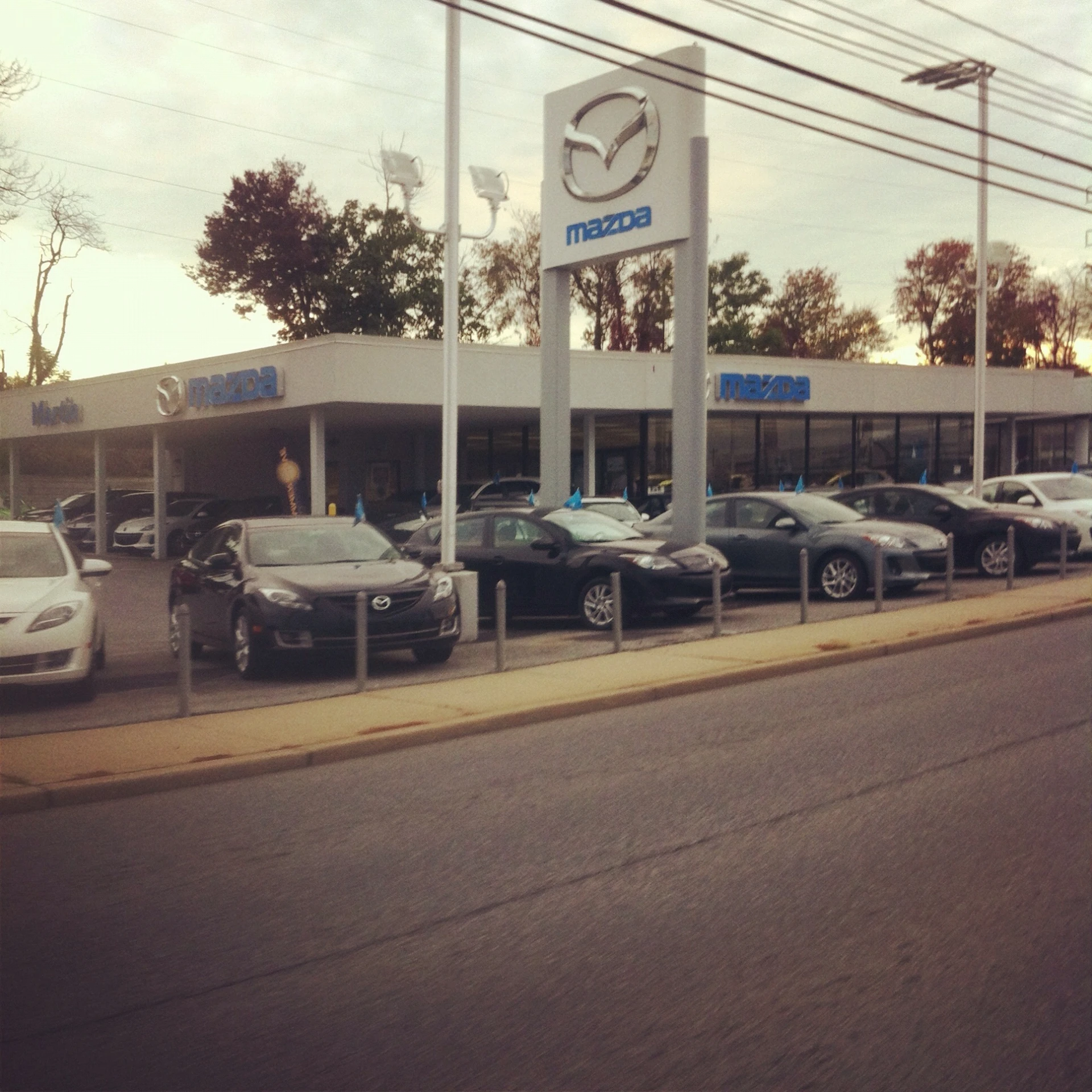 a couple of cars parked next to a gas station