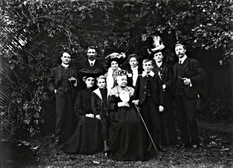 a group of people wearing fancy clothes and holding canes