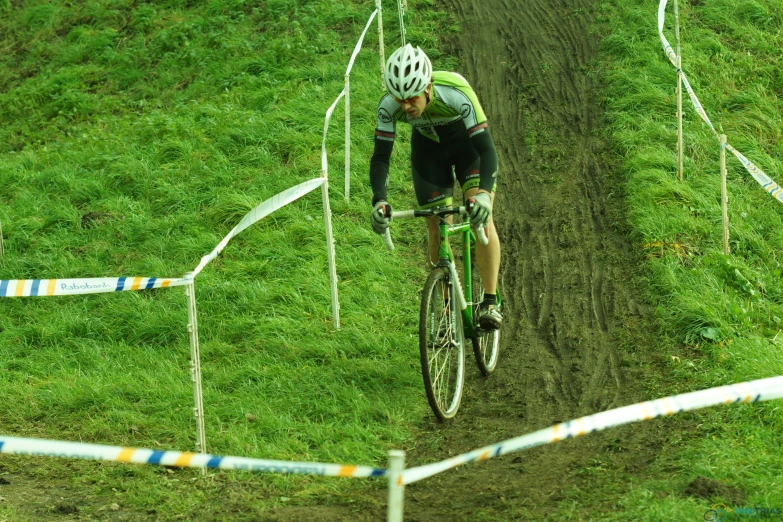 a person is racing a bike through some hills