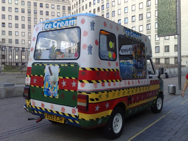 a little bus is painted like an ice cream truck